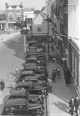 Cars parked in Enfield Town, 1946
Of the 15 cars shown, only one is a colour other than black.
Keywords: road transport;cars;The Town;1940s