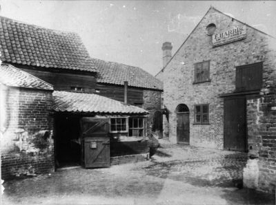 F. H. Harris, smith and farrier
Harris the blacksmith was situated between the back of what was later Freeman's the bakers (1980) and Gas House Lane, Sydney Road, and was certainly in business in 1895. Later it is thought that the smithy was taken over by Fullers the ironmongers who had a shop at the corner of Silver Street and the Town for many years. The notice reads: "F. HARRIS / SMITH AND FARRIER / LOCKSMITH BELL HANGER GASFITTER / MACHINERY AND FARM IMPLEMENTS REPAIRED"
