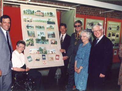 Presentation of wall hanging, 1996
The Enfield Branch of the Embroiderers' Guild presented a wall hanging illustrating the work of the Enfield Preservation Society at an exhibition [i]A panorama of preservation[/i] held at Forty Hall in June 1996. 
Left to right: Tim Eggar MP (Enfield North), Valerie Carter (President of EPS), Michael Portillo MP (Enfield Southgate), Patrick Cunneen (Mayor of Enfield), Muriel Evans (Embroiderers' Guild), and Ian Twinn MP (Edmonton).
Keywords: 1990s;Enfield Preservation Society;exhibitions;events;EP1