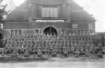 Volunteer Training Force
Group of men in military uniform outside the Drill Hall, Old Park Avenue. Includes cyclists, a motorcyclist and a military band. Date estimated by the National Army Museum, who consider that the unit might be the Middlesex Volunteer Training Force, photographed outside the drill hall of the 5th Battalion, Middlesex Regiment.

Photograph includes letter from the National Army Museum confirming the Volunteer Training Force uniforms and badges
Keywords: army;military forces;uniforms;World War I