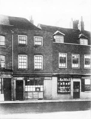 Post Office and Mr Tuff's chemists shop, about 1860
Enfield Town south side, showing the old Post Office, in Miss Leach's shop, two doors from the George Inn. Moved 25 years later to Southbury Road and opened in 1884 after alterations by Mr [Jarrhead ?]. (Recollections of old Enfield, 1910.) 

[i]Reproduction right held by Enfield Local Studies Library and Archive.[/i]
Keywords: retail;post offices;1860s;chemists