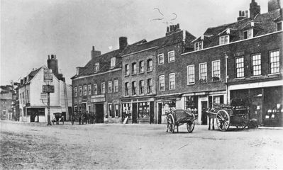 Enfield Town, south side, 1868
From left to right: The George inn, Meyer's stationers, printers and booksellers, Post Office, Tuff the chemist, Henry Cave the grocer. Mr Meyer started the Observer in 1859, published monthly, 8 pages, price 1 1/2 d.
Keywords: The Town;1860s;stationers;chemists;grocers;pubs;horse-drawn vehicles