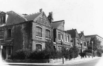 Palace Gardens houses before demolition
These houses had been allowed to decay pending demolition to make way for the precinct scheme. The houses were thought to have been built about the turn of the century (around 1900). The rear of Pearsons is on the right.
