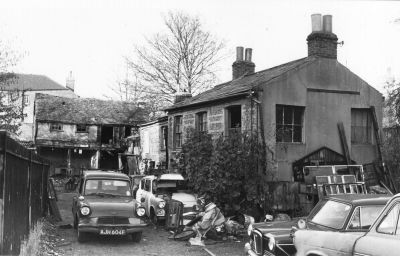 Laing's Garage
A narrow turning nearly opposite Raleigh Road. The old houses on the right with the decorative brickwork were reputed to be at least 200 years old at their demolition in 1979.
