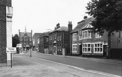 Sydney Road
A view from approximately opposite the site of Fairhead's offices and workshop, looking toward Barclays Bank in the Town. On the left by the "No parking" notice is the fine Eastern Gas offices and showrooms, then Barclays Bank, and on the right hand corner the National Westminster Bank. Next come the two old Enfield Gas Company offices of 1906 and 1897, and then the Duke of Abercorn public house.
Keywords: pubs;banks;gas