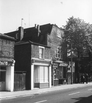 329 Baker Street
Included in "Looking at buildings" exhibition, Forty Hall, August 1976.
"Roberts the hairdressers and to the left what was to become Charles Varney betting shop. - [i]Walters, 2010-11-29[/i]
