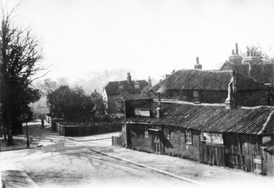 Corner of Chase Side and Trinity Street, 1897-1898.
Mr Welch's cottage centre back. 

[i]Reproduction right held by Enfield Local Studies Library and Archive.[/i]
Keywords: 1890s;houses;roads and streets