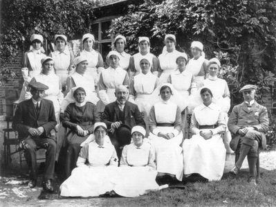 Nurses at Elm House
Elm House in Gentleman's Row was used as a convalescent home for wounded soldiers during the first World War. Percy Leggatt is on the left and Dudly Leggatt on the right. They allowed the War Office the use of the house rent free and provided £300 for necessary alterations. In the centre of the second row sits Dr Howard Distin of Holtwhites House. - [i]History of Enfield[/i], vol.3, p.30.
Keywords: 1910s;Gentlemans Row;hospitals;World War I;people