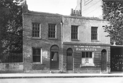 The Town Toilet Saloon
When the 'Palace' site was auctioned in July 1918, lot one comprised two old shops belonging to Goodman the saddler and Watts the barber. The purchaser was Pearson whose premises adjoined. Watts moved to Genotin Road where the business continued until the redevelopment in the first decade of the 21st Century.

[i]Reproduction right held by Enfield Local Studies Library and Archive.[/i]
Keywords: shops;barbers