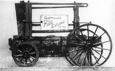 Enfield's first fire engine, 1790
This appears to be on display outdoors - there are railings and trees behind it. Does anyone know where it is now?
Keywords: 1790s;fire engines