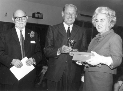 Presentation to Tony and Carinthia Arburthnot Lane
Godfrey Groves, EPS President (centre) presented a cheque and an antique silver cream jug at the 1972 AGM as a token of their outstanding service to the Society. - [i]Fighting for the future[/i], page 108.
Keywords: FP5;1970s;events