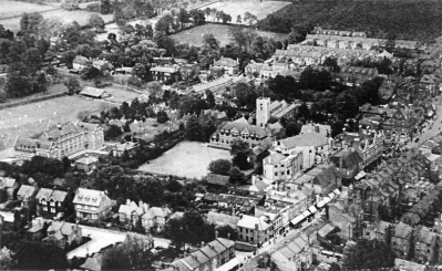 Enfield Town in the early 1930s
Showing St Andrew's Church, Enfield Grammar School, the Rialto cinema and Church Street in the foreground. The fields in the background were soon to be covered by the Willow estate. [i]Fighting for the future[/i], page 13.
Keywords: 1930s;aerial;FP2