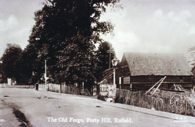 The old forge, Forty Hill
From a postcard. The business survived there until about 1923. - [i]History of Enfield[/i] vol.3, p.161.
Keywords: blacksmiths;farriers;weatherboarding;postcards