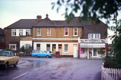 Bridgenhall Store, Forty Hill, 1976
Near the Goat public house, at the south-east corner of the junction between Russell Road and Hallside Road. The shop is now closed.
Keywords: shops;1970s