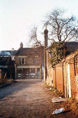 Tenniswood Road at junction with Baker Street, 1962.
Looking west, at side of Carlton House.
Keywords: 1960s;roads and streets