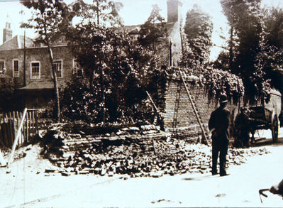 The Rectory, Parsonage Lane
This stood on the north side of Parsonage Lane. It was sold for buillding in 1926. Also known as the Rectory Manor House. Part of the garden wall has collapsed in this picture. 

[i]Reproduction right held by Enfield Local Studies Library and Archive.[/i]
Keywords: demolished buildings;historic houses