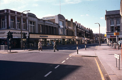 The Town looking west along Church Street
Millets and Pearsons shops on the left, Burton the tailors on the right, beyond the market place. 
Keywords: 1970s;shops;roads and streets