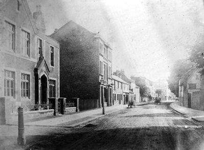 Silver Street looking south, 1905
Print has caption "Silver Street looking south from Churchbury Lane. Early 1900s", with the addition in pencil "c.1880?". The building on the left is the Church School of Industry.
Keywords: roads and streets;1900s;Church School of Industry