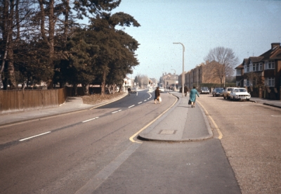 Baker Street, 1976
View towards the junction with Parsonage Lane, after traffic lights were installed there. The left-hand lane has been widened and the footpath diverted behind the trees.
Keywords: 1970s;roads and streets