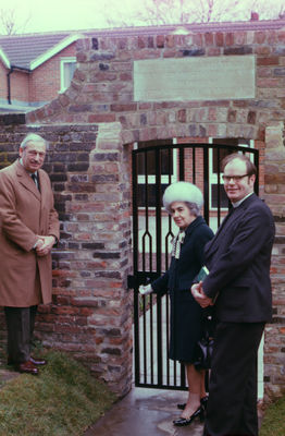 Opening of arch between churchyard and parish centre
Opened by Carinthia Arburthnot Lane, with Rev. Peter Morgan, vicar of Enfield (right). Stone tablet reads "This gateway was erected by the Enfield Preservation Society in memory of Clayton Arburthnot Lane TD, 1903-1975". 
Keywords: memorials;gateways;St Andrews Church