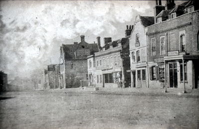 The Town, north side
Greyhound Inn at centre, old police station beside it. The Greyhound was demolished in 1897 and the site is now occupied by Barclay's Bank. The old police station to its right is now known as the Old Vestry Offices, and is now the office of the Old Enfield Charitable Trust. Building at the right has signboard reading "F. YOUNG" 

[i]Reproduction right held by Enfield Local Studies Library and Archive.[/i]
Keywords: inns;The Town