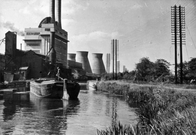 River Lea Navigation at Brimsdown power station
Barge on the canal. Telephone pole with about 17 cross arms and about 72 separate cables. 
Keywords: 1960s;canals;boats;telephone cables;power stations;cooling towers;