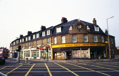 Enfield North Labour Party offices, March 1989
Southwest corner of junction of Southbury Road and High Street. Red sign is that of "Job Centre".
Keywords: shops;offices;roads and streets